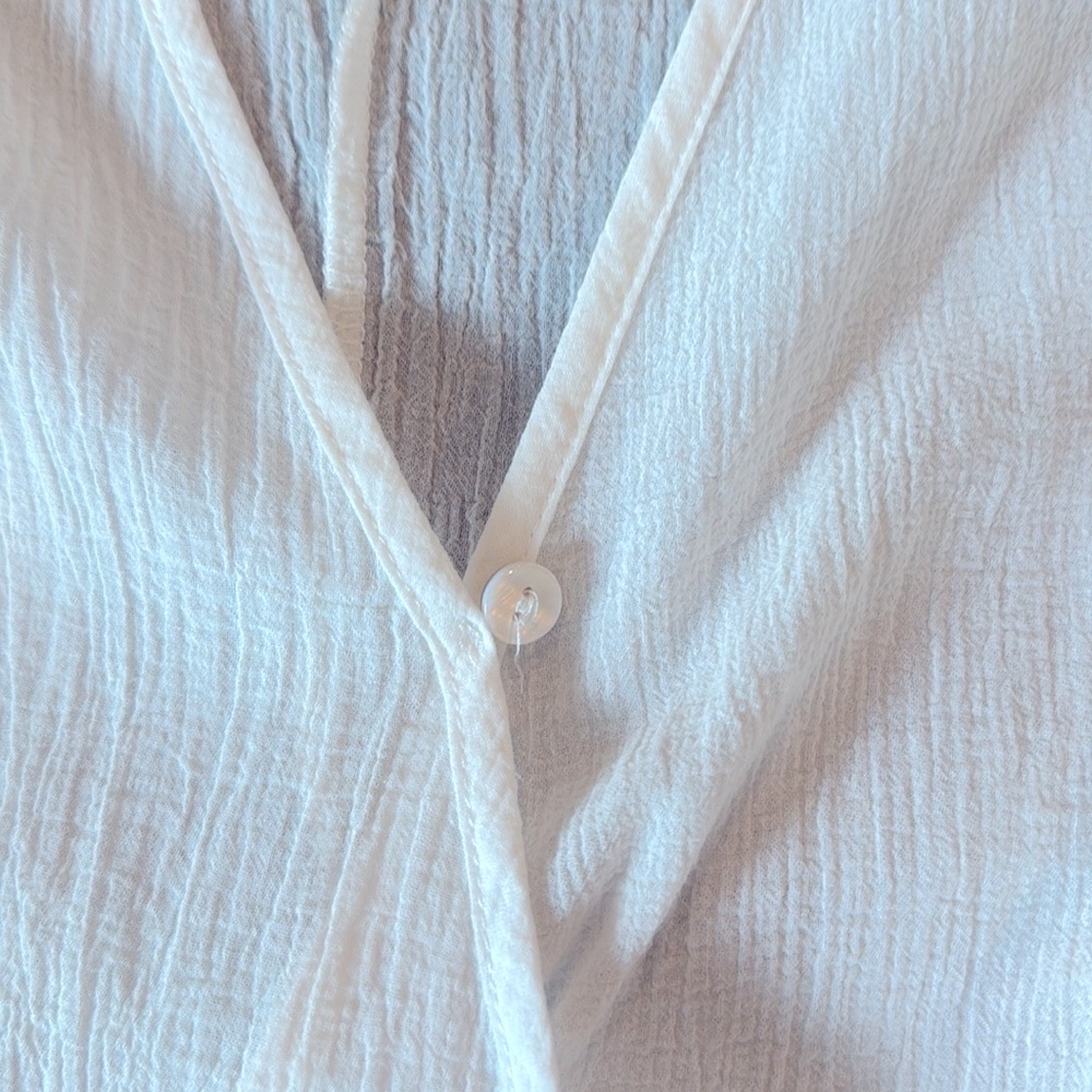 Sheer white dropped shoulder top.